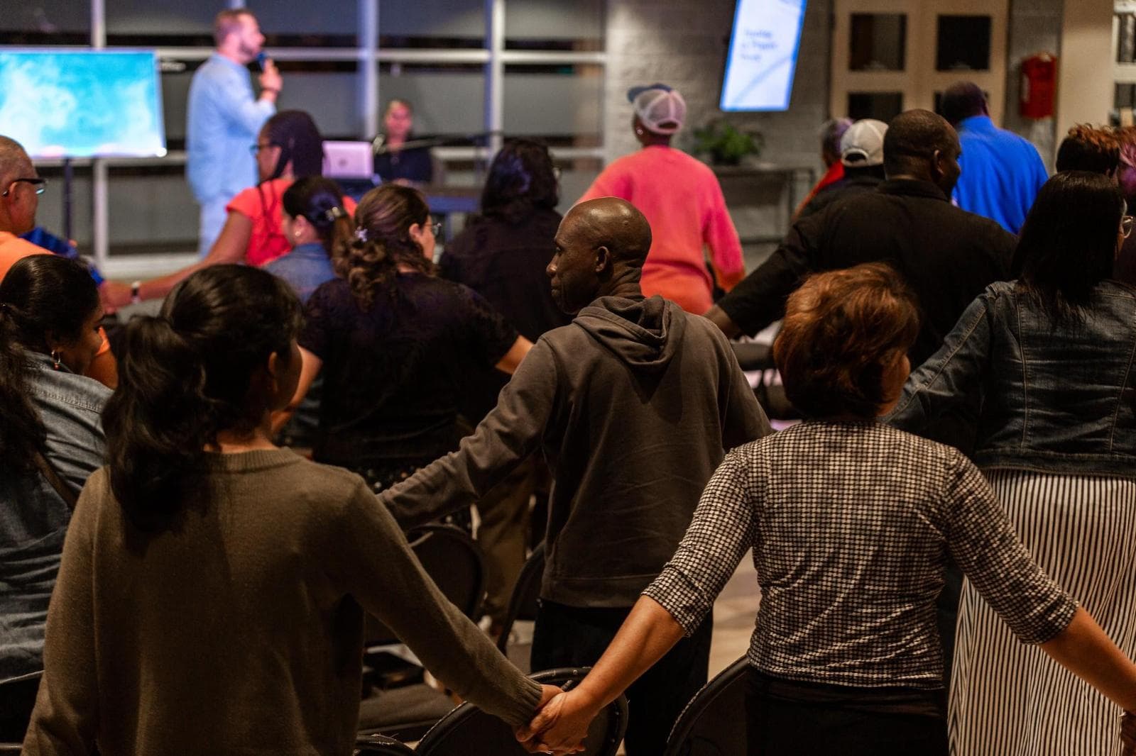 Congregation holding hands